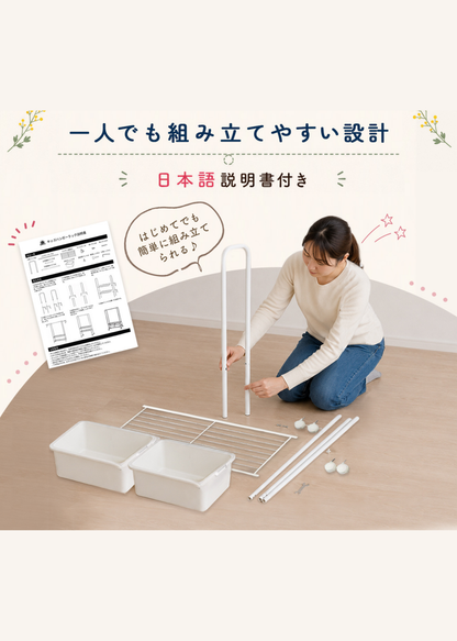 キッズハンガーラックの組み立てイメージ。付属の日本語説明書を見ながら一人で組み立てている様子