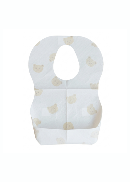 水色のクマ柄使い捨てエプロンを正面から見た商品画像。くすみカラーの子ども用食事エプロン